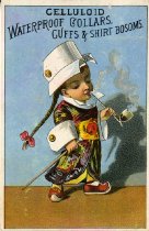 Celluloid Trade Card featuring a boy with a long braid smoking a pipe and wearing a cuff on his head
